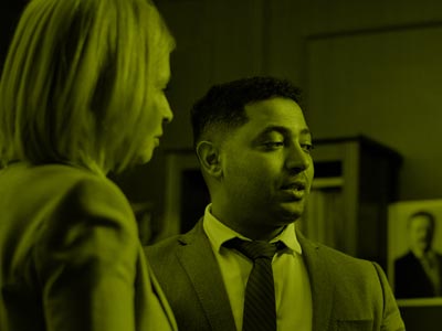 Man and woman talking in meeting