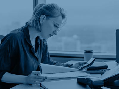 Lady sat with paperwork